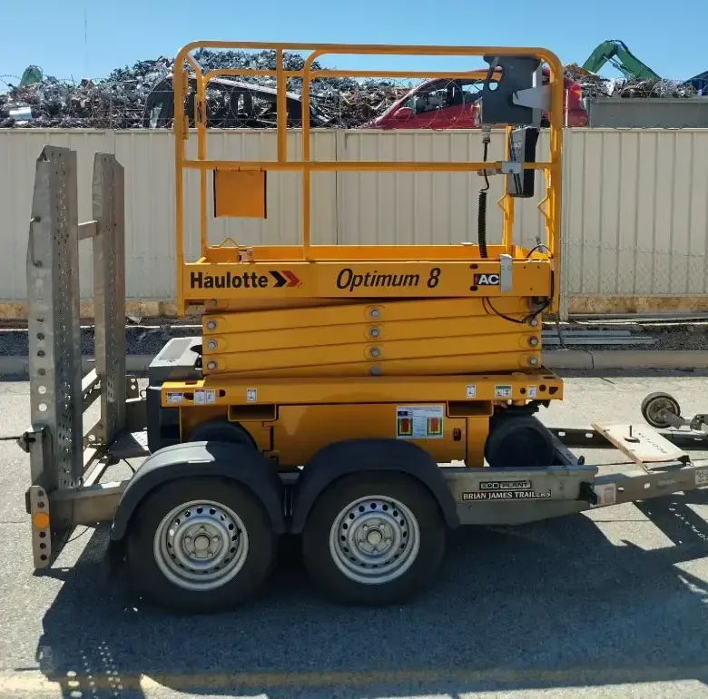Electric scissor lift loaded on our transport ready for delivery